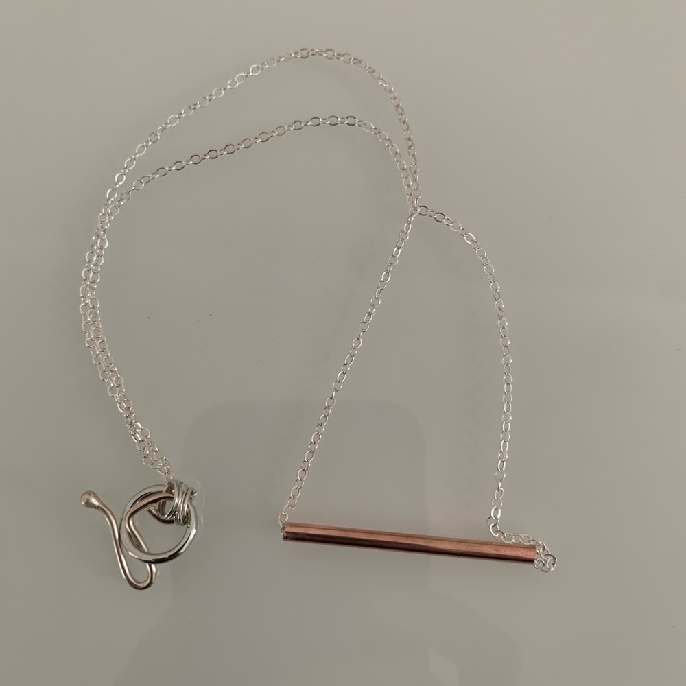 Sterling silver pendant necklace with copper bar